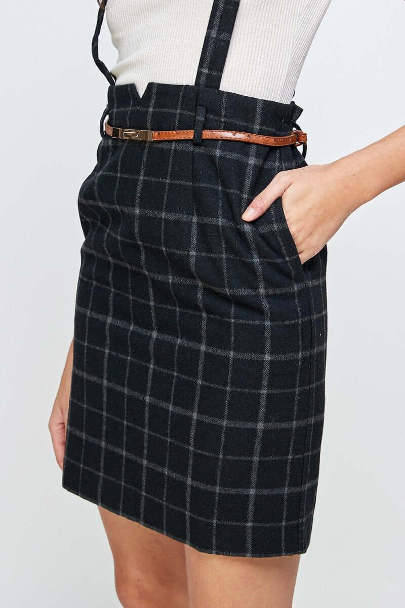 Plaid Suspender Skirt with Belt Detail featuring a chic high waisted design and pockets, perfect for modern elegance.
