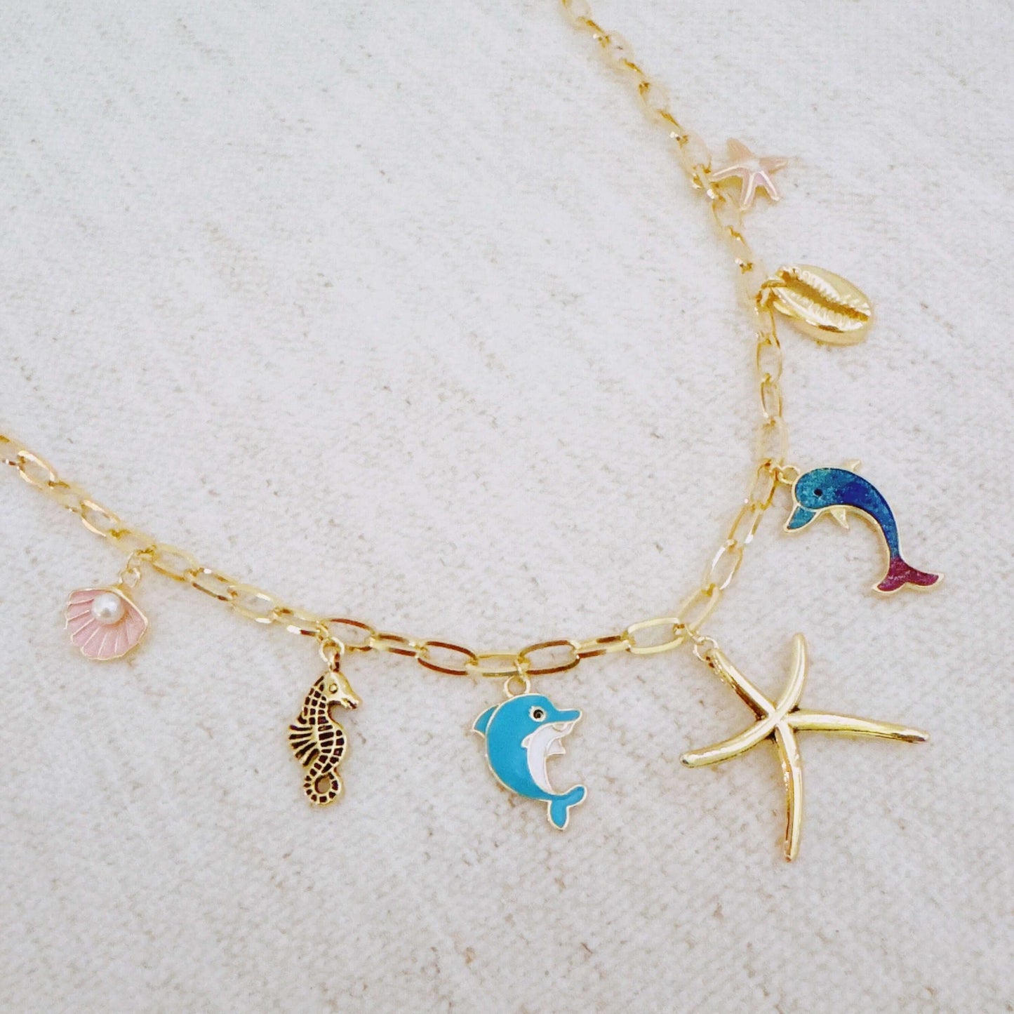 Ocean Play Charm Necklace – Dolphin, Starfish & Shell
