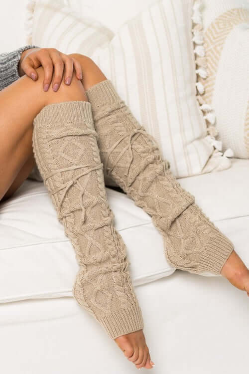 Cozy Cable Knit Long Tie Leg Warmer in beige, featuring removable ties and a thick knitted design.