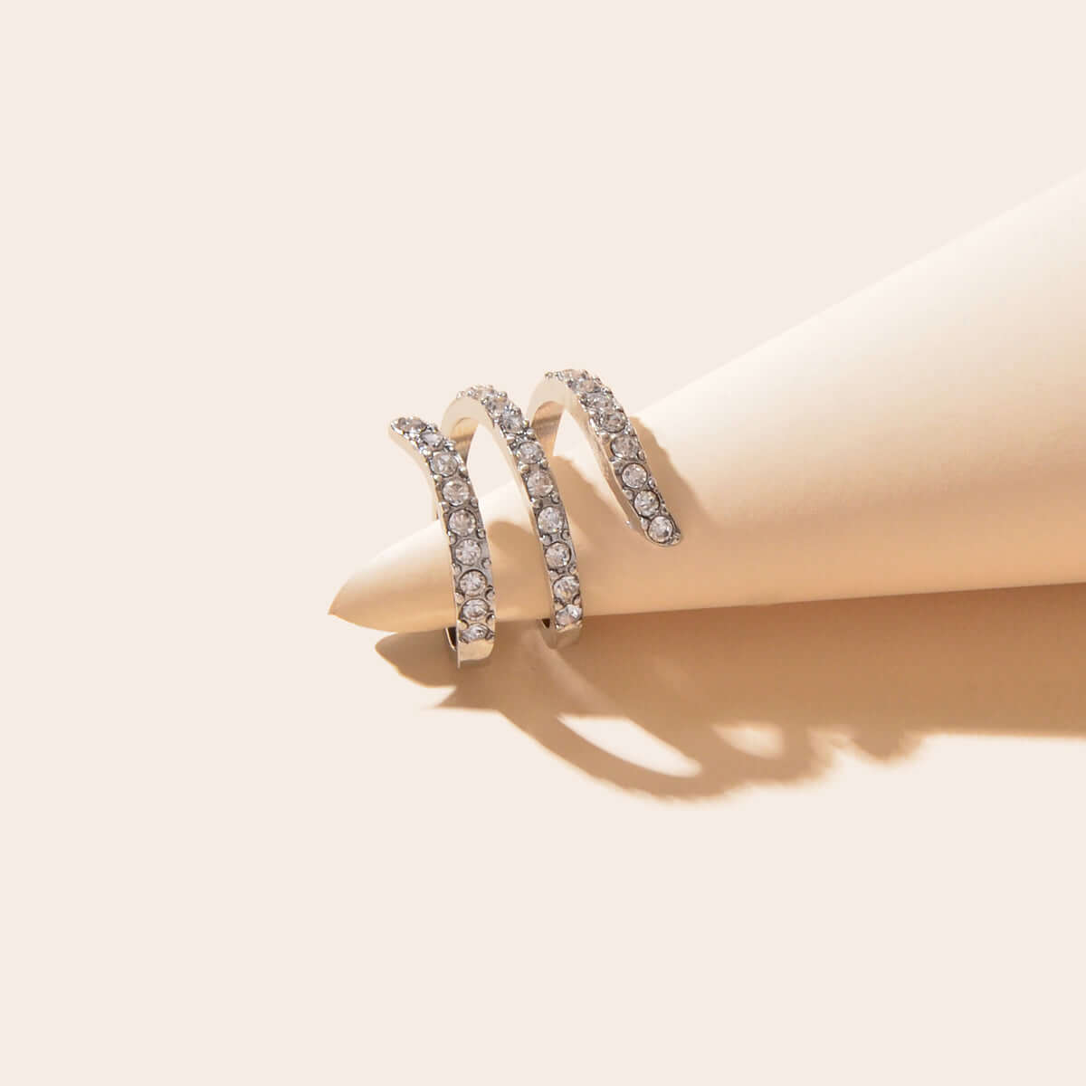 Bridal Jewelry Full Rhinestone Engagement Ring showcasing a spiral design with premium rhinestones in a soft light.