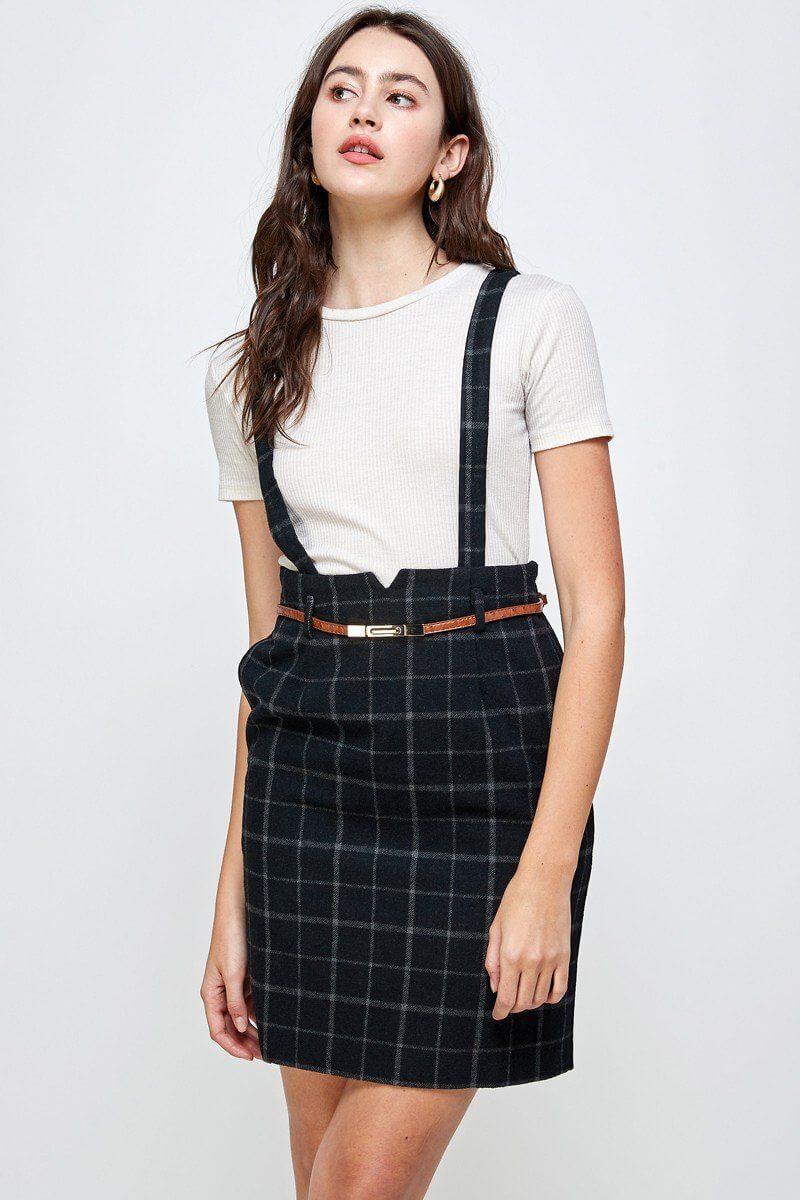 Plaid Suspender Skirt with Belt Detail worn by model, showcasing a chic, high-waisted design.