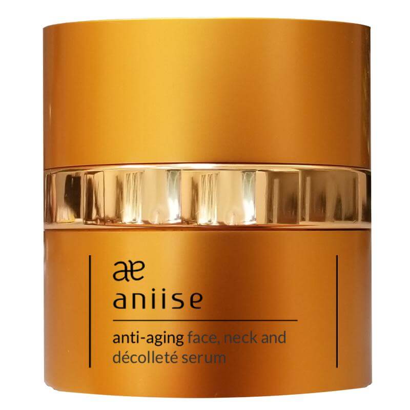 Aniise anti-aging face neck and decollete serum in a golden container for rejuvenation and hydration.