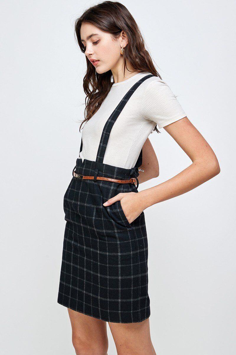 Plaid Suspender Skirt with Belt Detail worn by a model, showcasing its chic design and flattering fit.