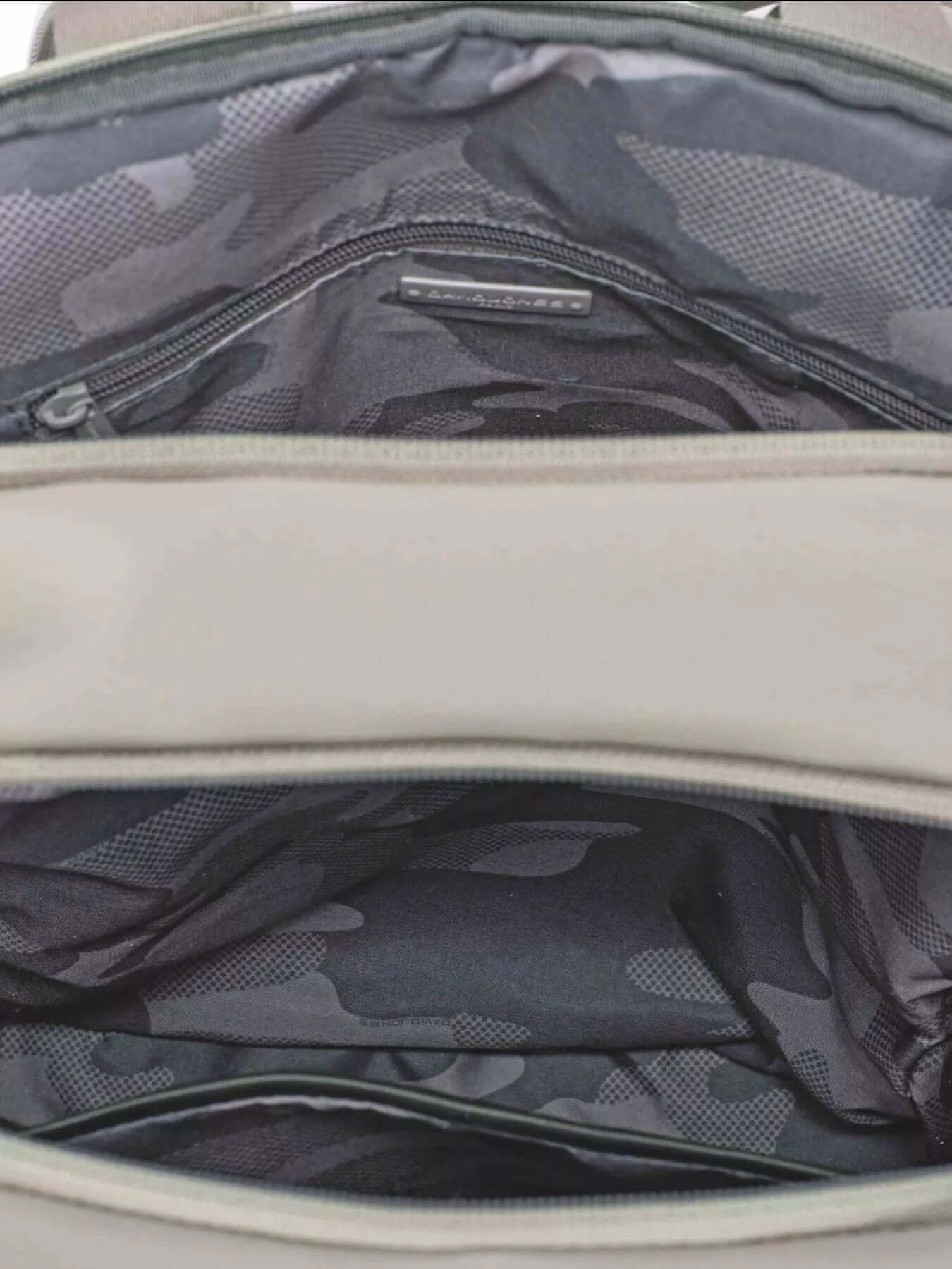 Interior view of the David Jones Canvas Backpack Bag with Dual Handle, featuring a spacious design and zippered compartment.