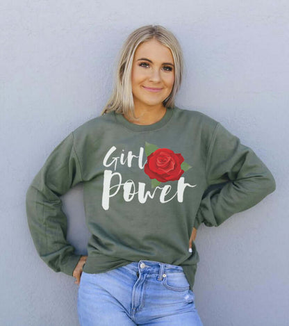 Girl Power Sweatshirt worn by a smiling model with a red rose graphic on an olive green background.