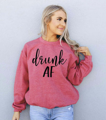 Model wearing a red Drunk AF Sweatshirt, showcasing its cozy style and casual look.