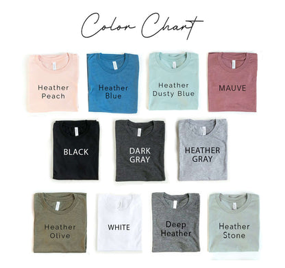 Color chart for Stuffed With A Baby T-shirt in various shades, including Heather Peach, Black, and White.