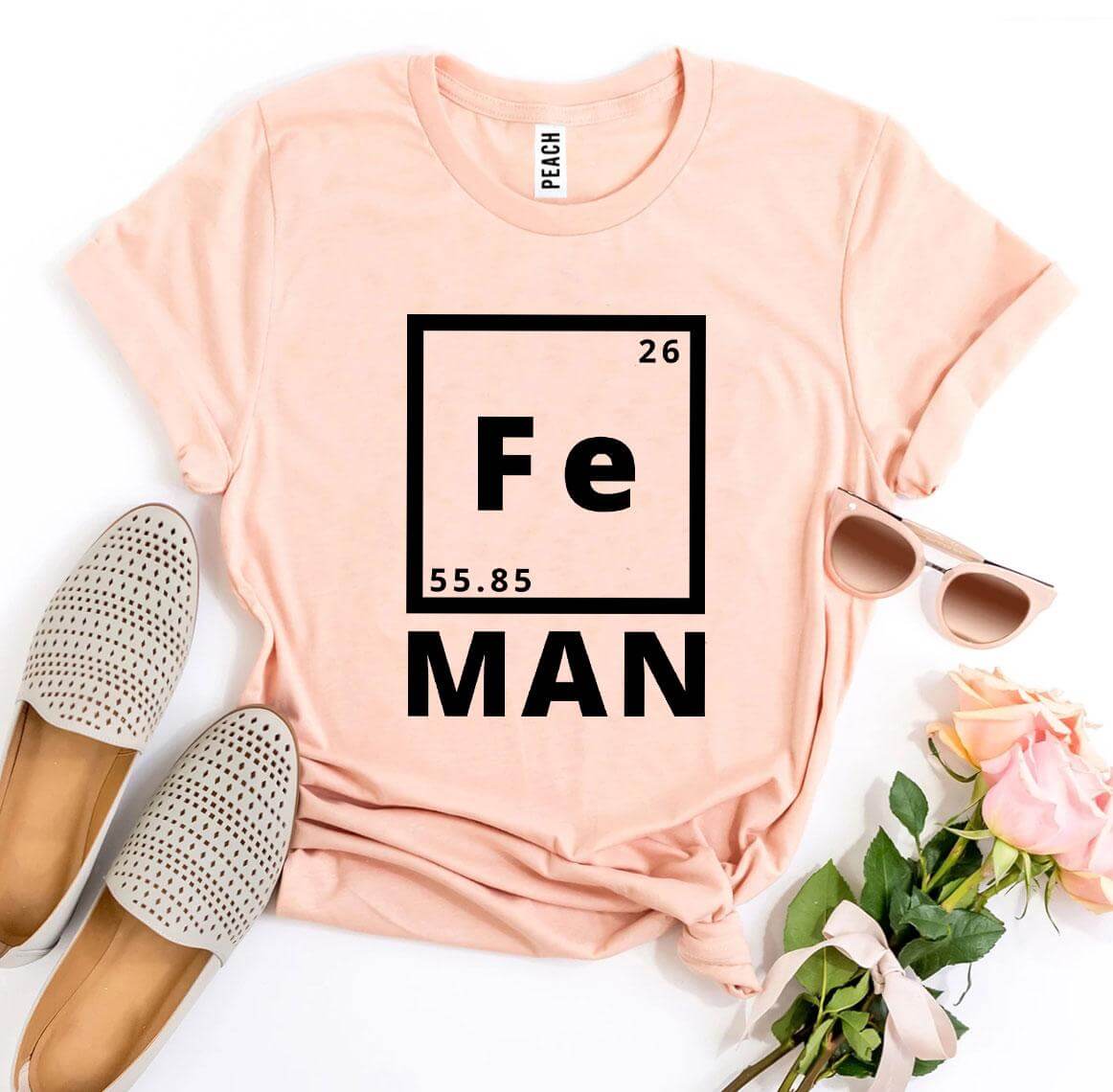 Iron Man T-shirt featuring a creative periodic table design on a soft peach cotton tee.