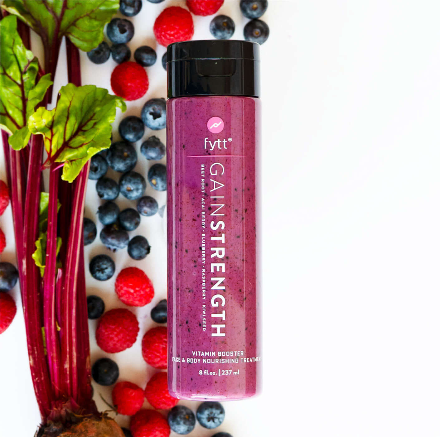 Ultra-Nourishing Exfoliating Mask in a vibrant bottle surrounded by fresh berries and beet leaves.