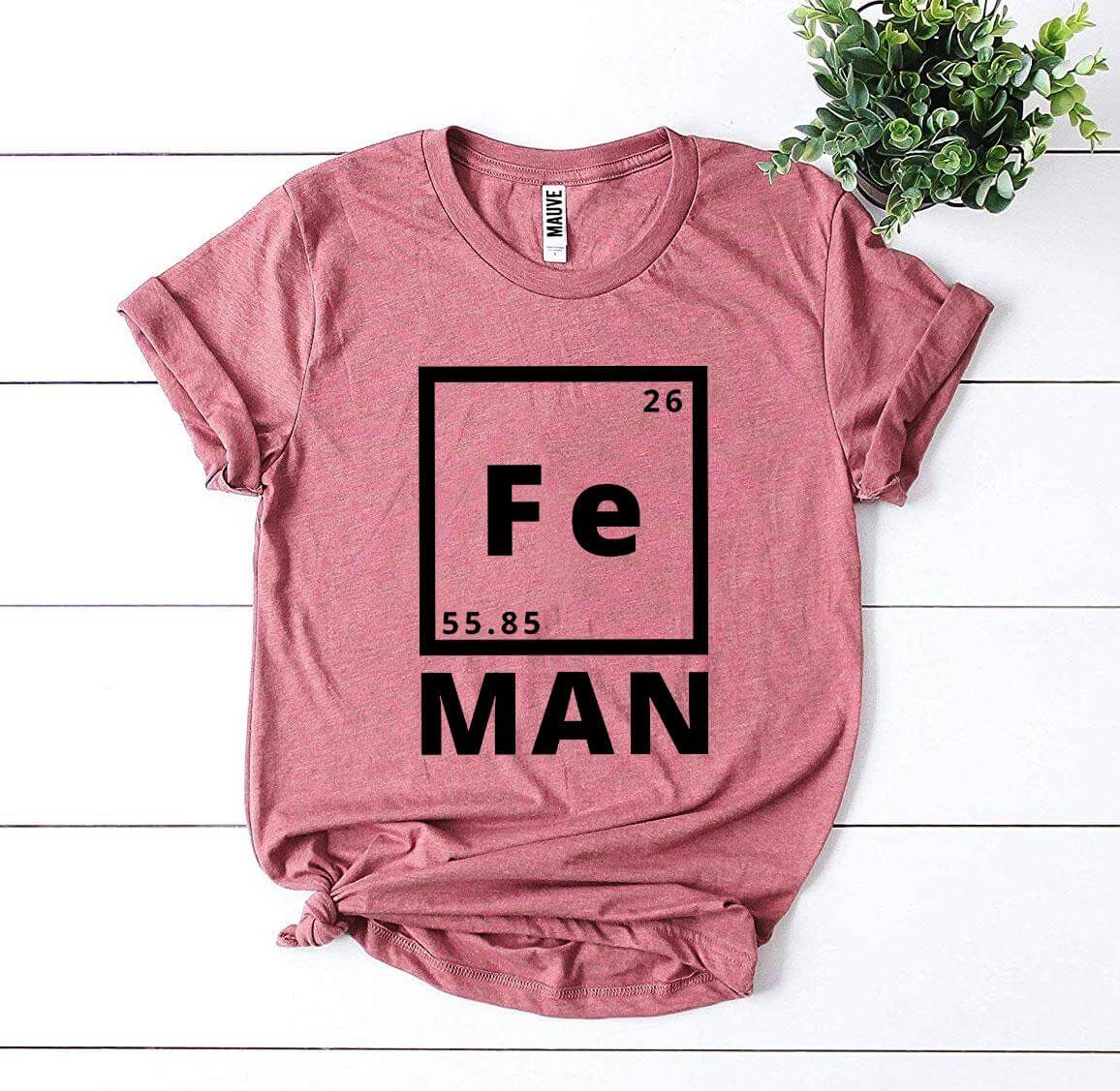 Iron Man T-shirt featuring periodic table design with Fe and MAN in bold black print on a red t-shirt.