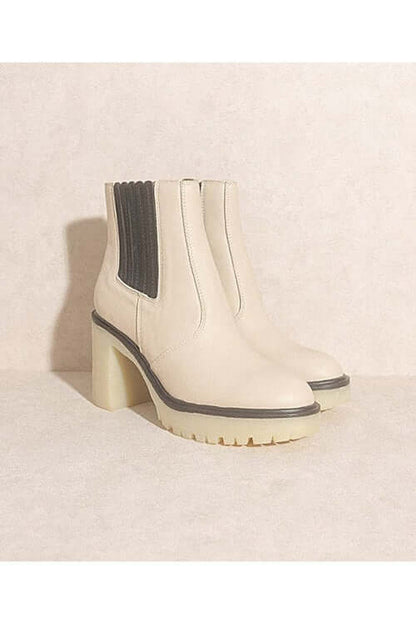 ANASTASIA- PANELED BOOTS FOR WOMEN'S: stylish beige paneled boots with chunky heels and black accents.