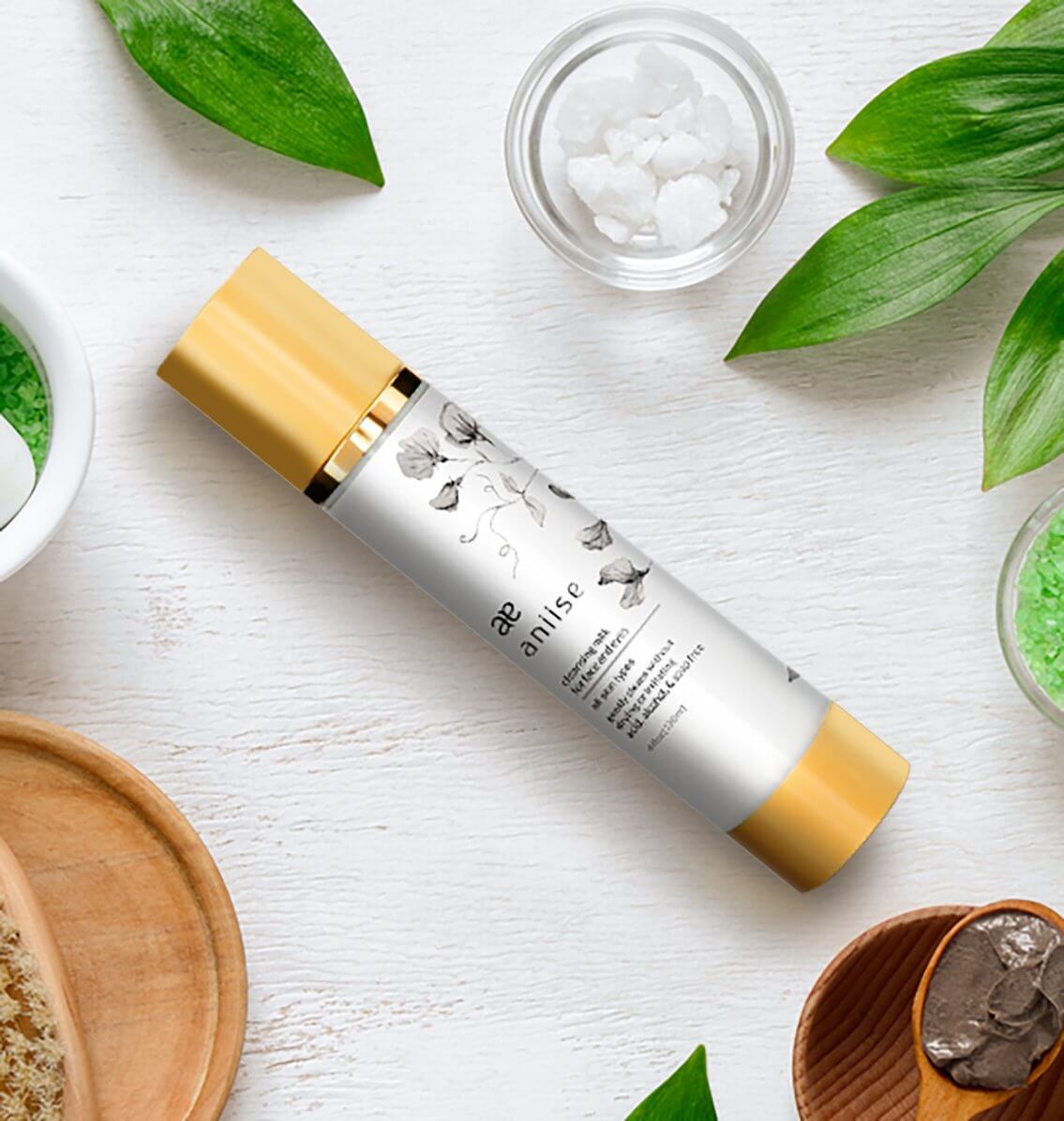 Cleansing Milk for Face and Eyes in elegant packaging surrounded by natural ingredients.